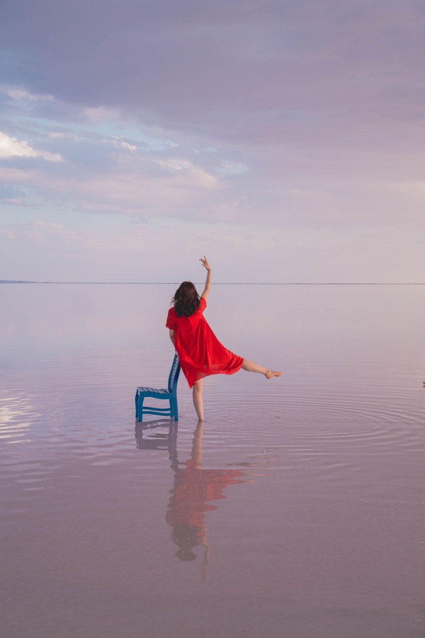 Red dress under a pink sky